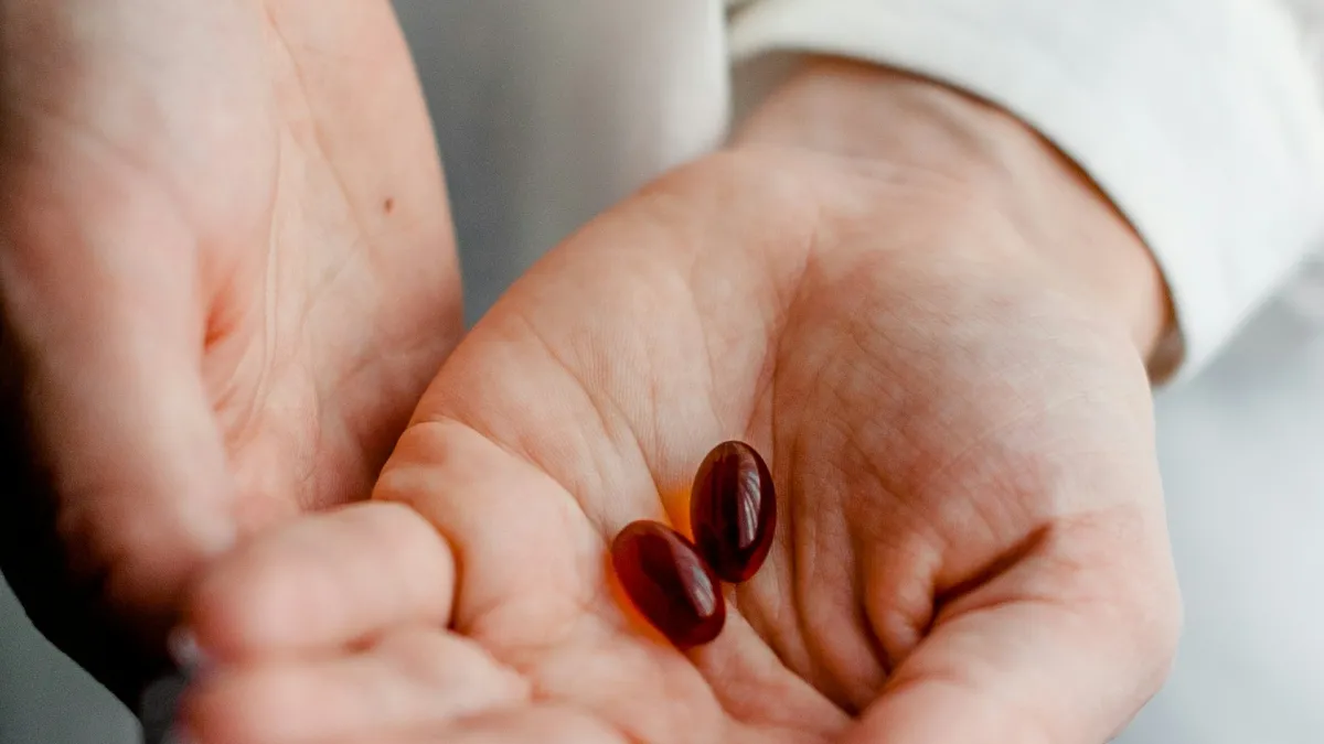 hands holding medicine