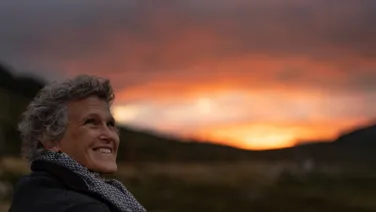 An ANU Research looking out across a mountain landscape