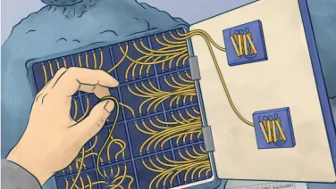 A person threads wires through a circuit board pattern in a notebook, with engineering sketches and tools visible beneath.