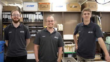 3 men looking at the camera smiling