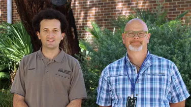 2 men looking at the camera