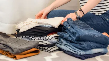 A person folding clothes